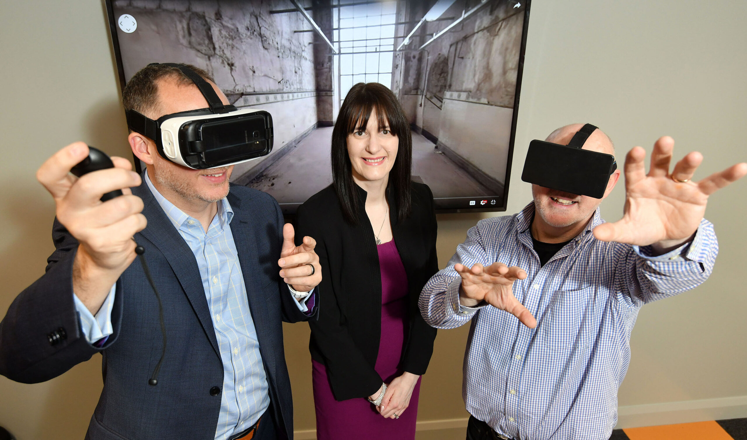 Two people using Virtual Reality Headsets