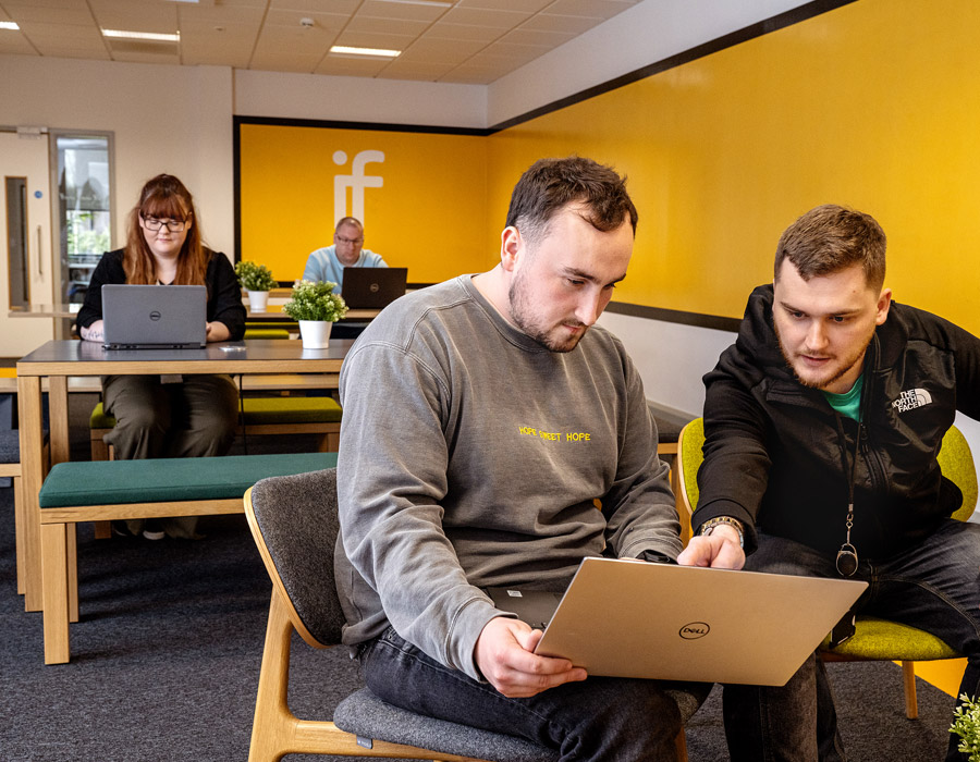 People coworking on a laptop