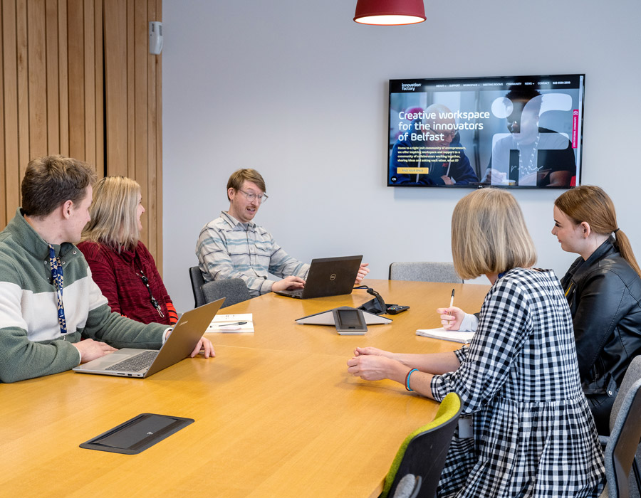 A meeting taking place with a screen