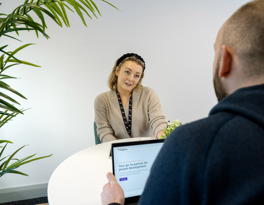 Two people meeting at a table